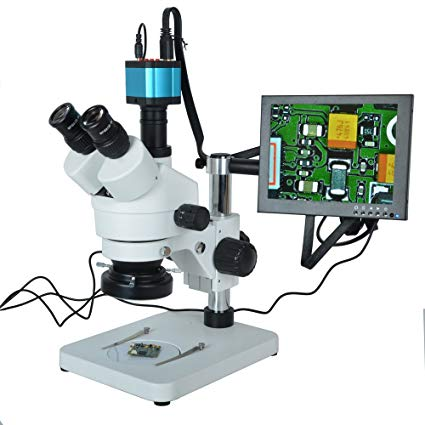 Stereo zoom trinocular microscope with a camera on the third port, linked to an LCD monitor showing a circuit board